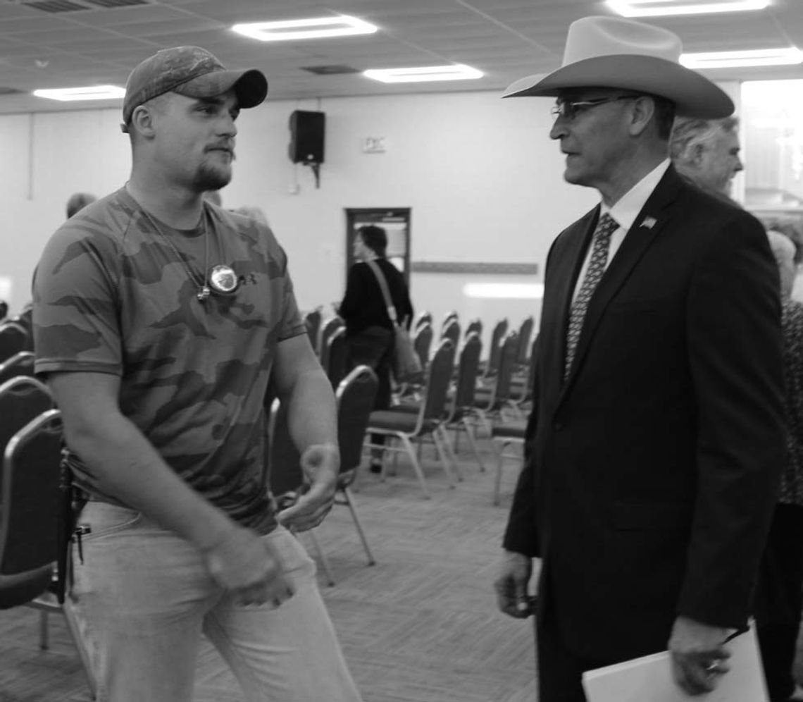 Devin Garkie (left) showed his support for Burnet County judge applicant Alan Trevino Feb. 6, during a county judge forum at the AgriLife Building.