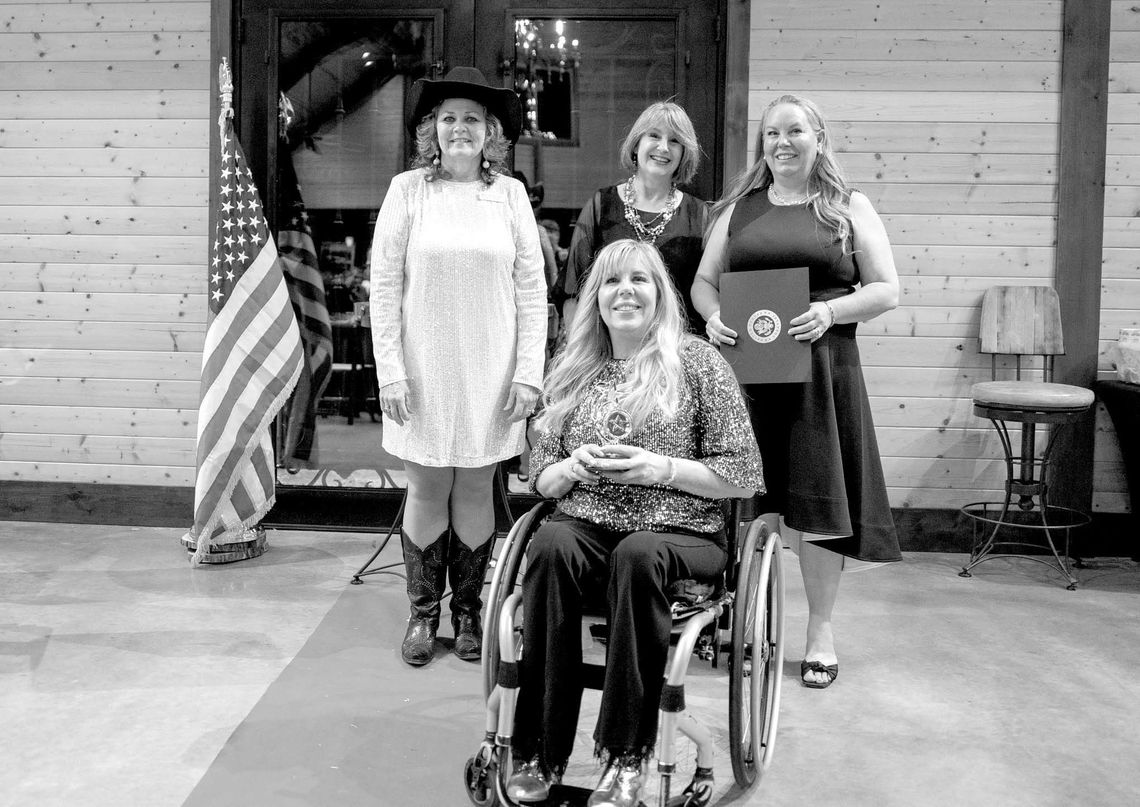 Pictured are Angie Godfrey, in front, and Darla Wilhite, back right, owners of Reflections Day Spa and Salon, who earned the Outstanding Business Award last year, presented by Melody Yanniell and Susan Patten, back left and middle. Contributed photos