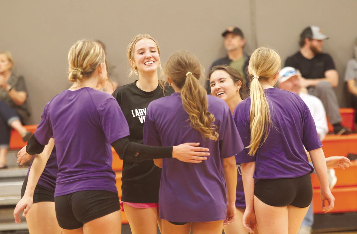 Tessie Bowen (left) and Hannah Welch are all smiles after the Lady Mustangs win a point during the Llano May League. Photos by Jennifer Fierro/TexasChalkTalk.com
