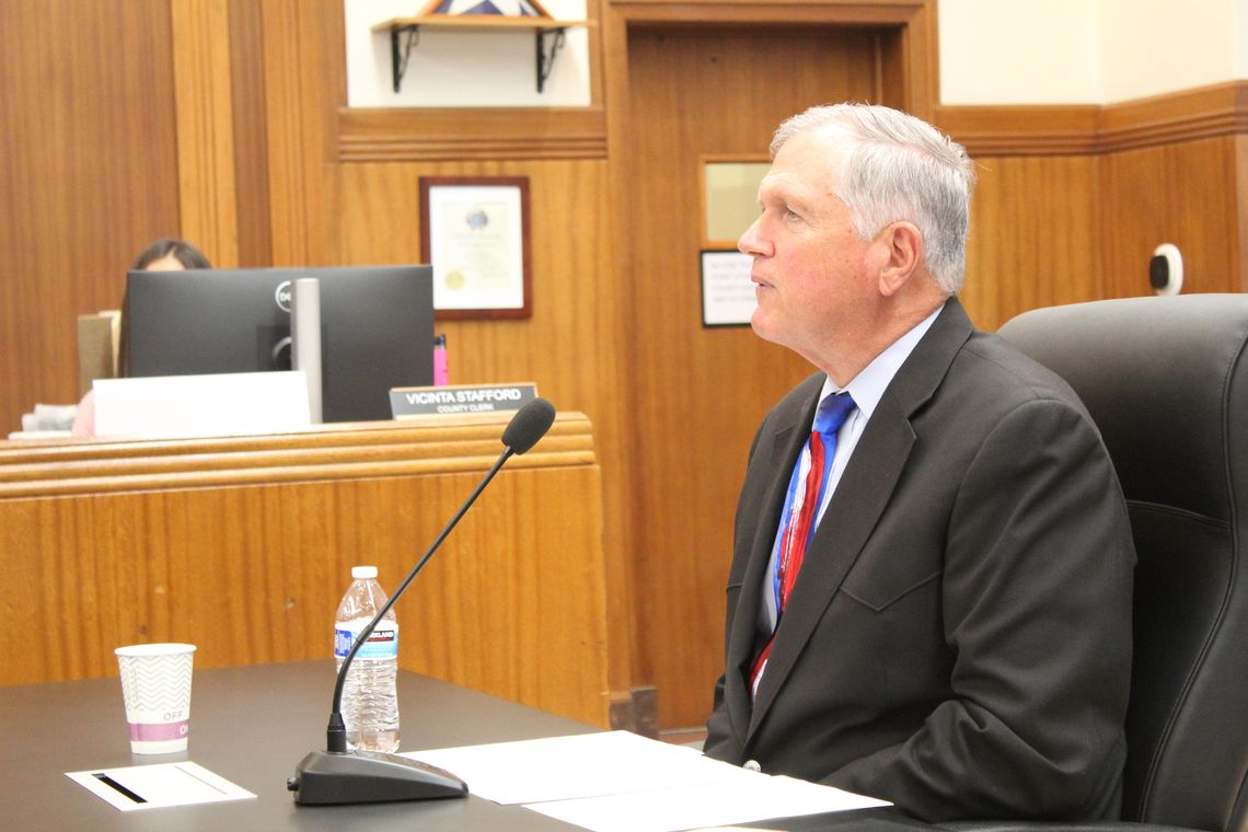 Former Texas grant manager and probation officer Bryan Wilson appears reflective as he responds to several question during the Burnet County Commissioners meeting Feb. 11. 