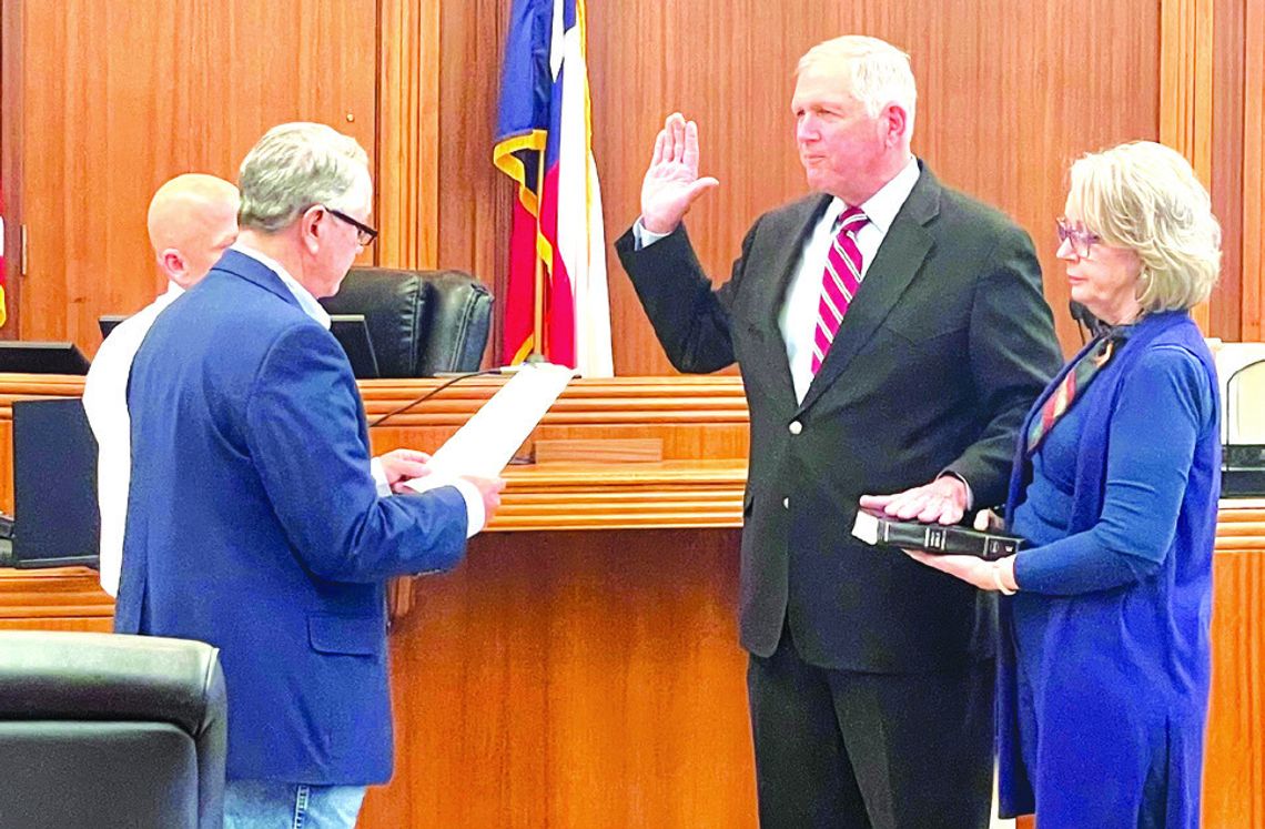 On March 12, Bryan Wilson with his wife Holly by his side was sworn in as the new Burnet County judge by Pct. 4 Commissioner Joe Don Dockery. Pictured be- hind Dockery is Pct. 2 Commissioner Damon Beierle. Contributed/Stephanie McCormick