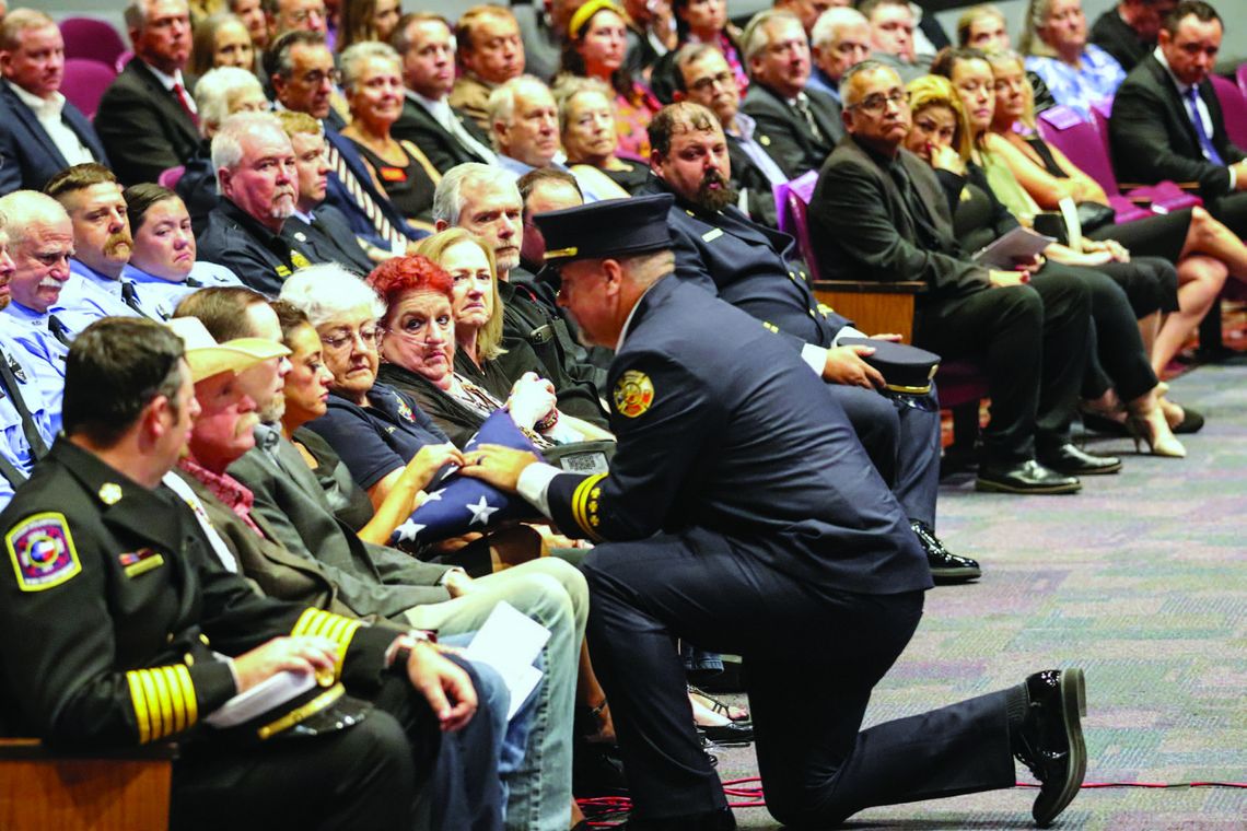Community mourns at fallen fire chief 's memorial