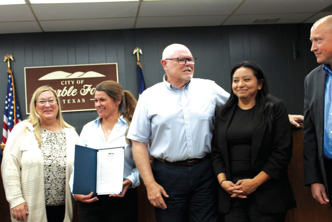 Marble Falls City Council proclaimed May 4-10 as Pub- lic Service Recognition Week during its May 6 meet - ing. Pictured, from left, are Highland Lakes Regional Emergency Communication Center Director Stacy Baker Marberry, Parks and Recreation Director Lacey Dingman, Mayor Dave Rhodes, Dev...
