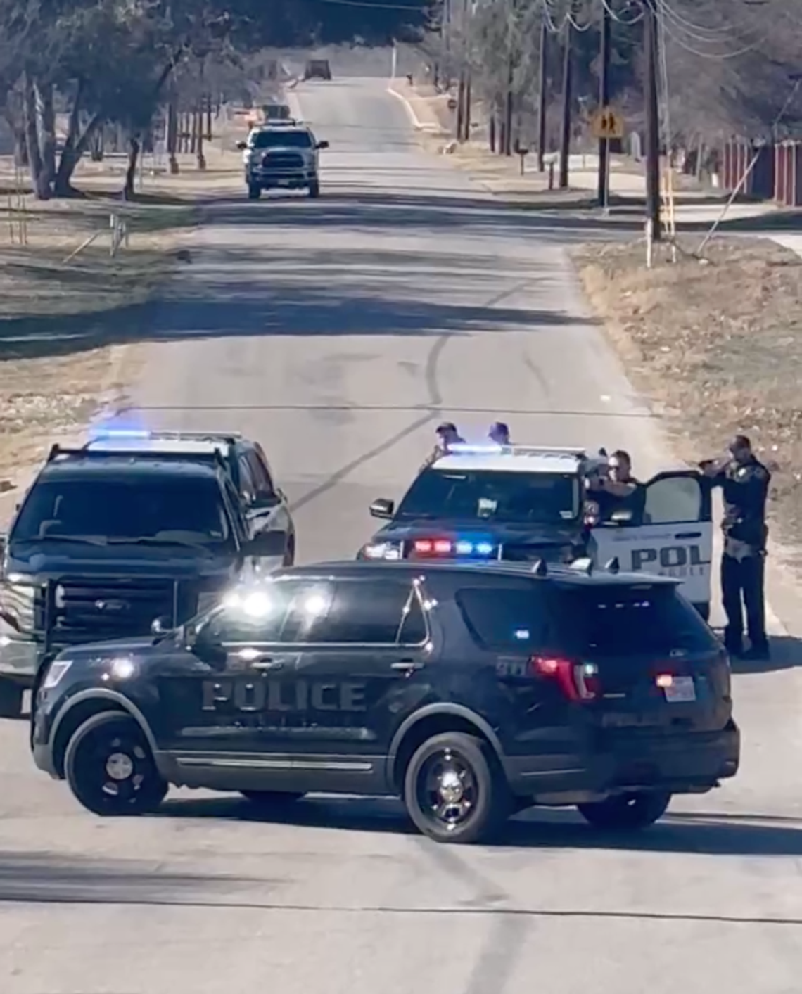 Marble Falls police swarmed a vehicle Jan. 16 just around 2:30 p.m. with weapons drawn on Second Street, west of Avenue N. The suspect, in his 50s, eventually surrendered about an hour an half later following a tense standoff. Contributed/Haley Booe