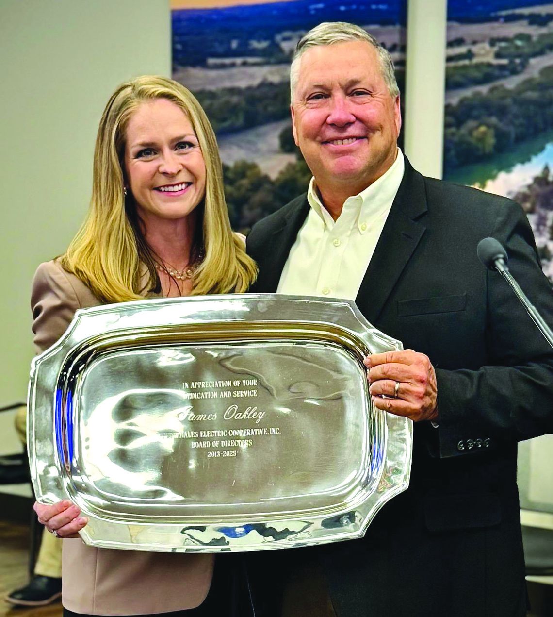 PEC president Emily Pataki presented outgoing District 5 Director James Oakley with an inscribed parting gift. Contributed photos