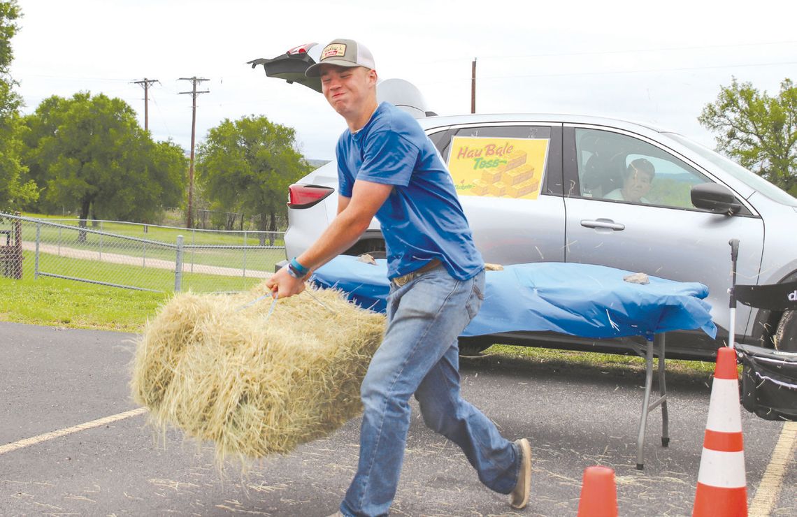 Alt Text forBrayson Hambrick demonstrated the hay bale toss game April 5, during the Marble Falls FFA Fest. Find more photos on Page 12. Photos by Martelle Luedecke/Luedecke Photography Image