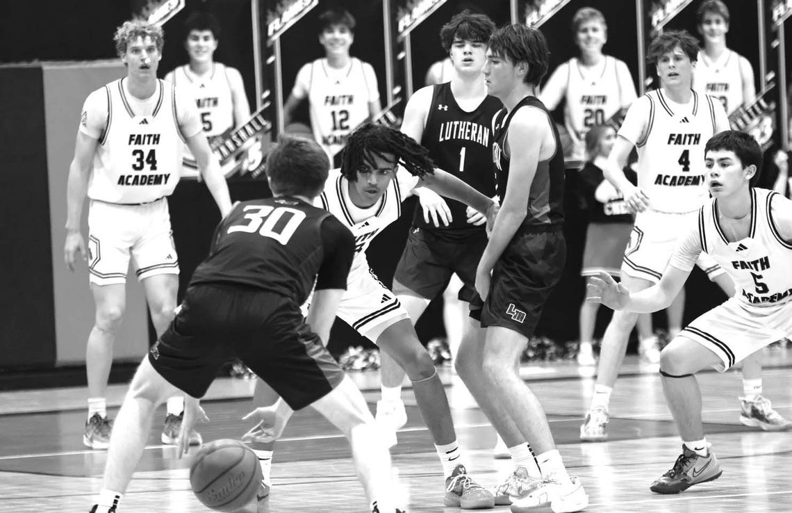 The Faith Academy of Marble Falls boys basketball team's 2-3 zone, featuring soph - omore forward Seattle Hampton (left) and junior guard Jase Marshall at the front, makes opponents uncomfortable. Photos by Jennifer Fierro/TexasChalkTalk.com