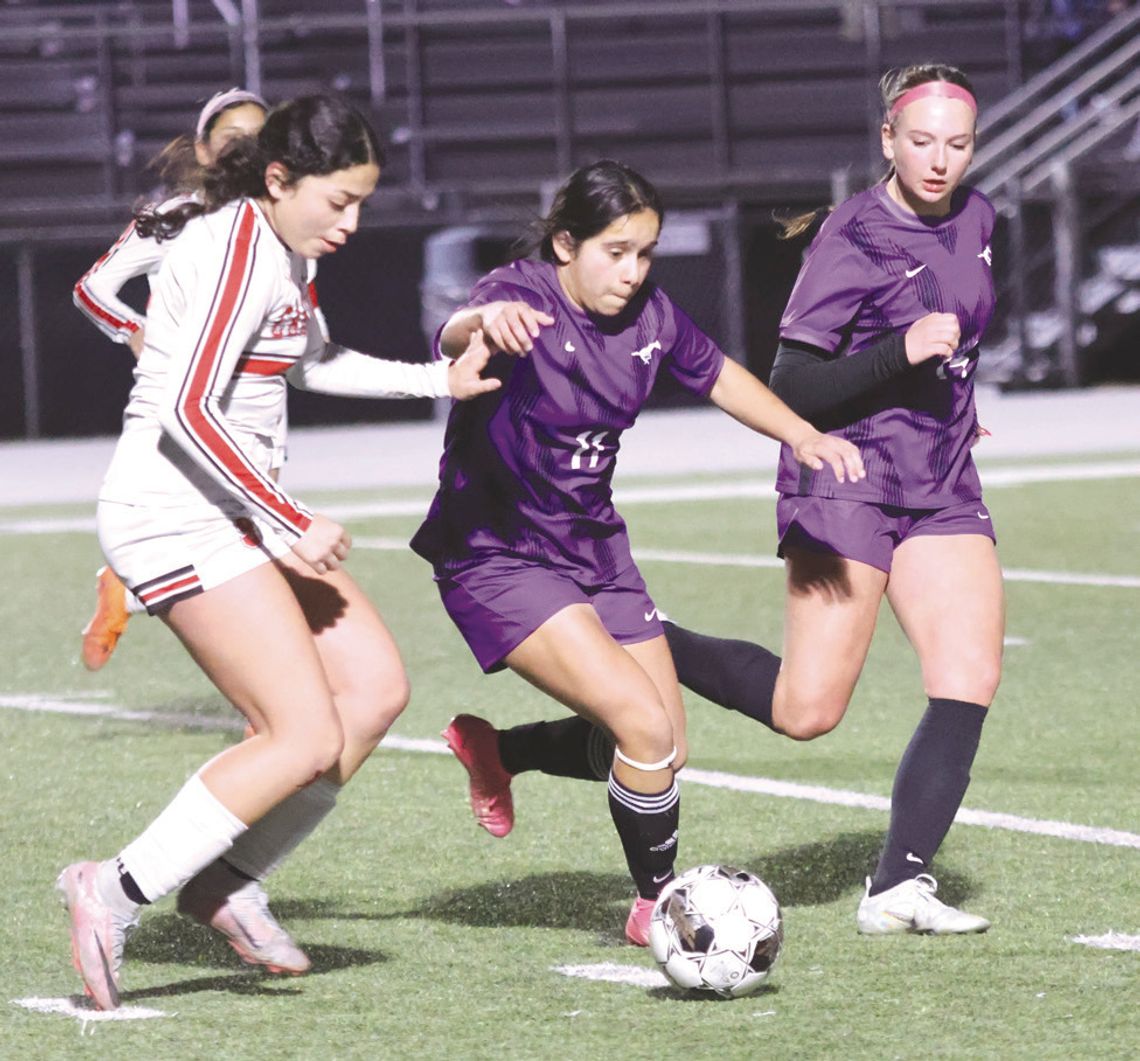 Marble Falls sophomores Suzena Perez Angel (left) and Madison Hardaway are fast to the ball and want to put their team in scoring position.