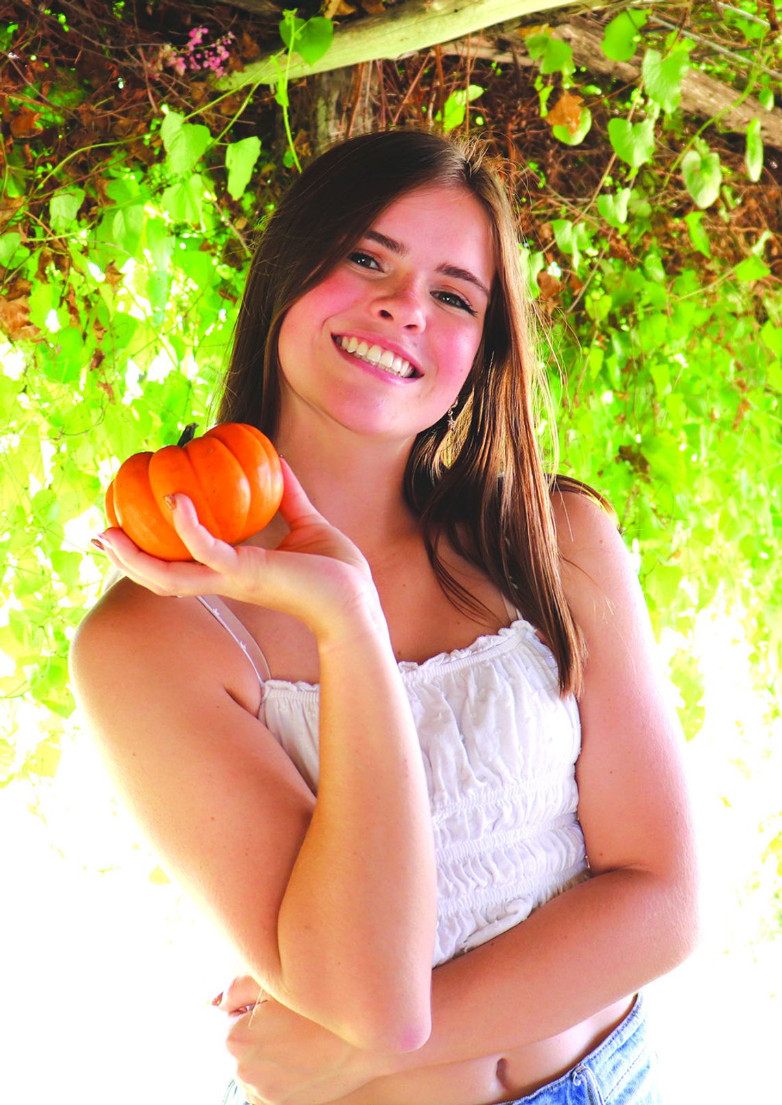 Grace Gates picks out the perfect pumpkin while at Sweet Berry Farm in Burnet County. Martelle Luedecke/Luedecke Photography