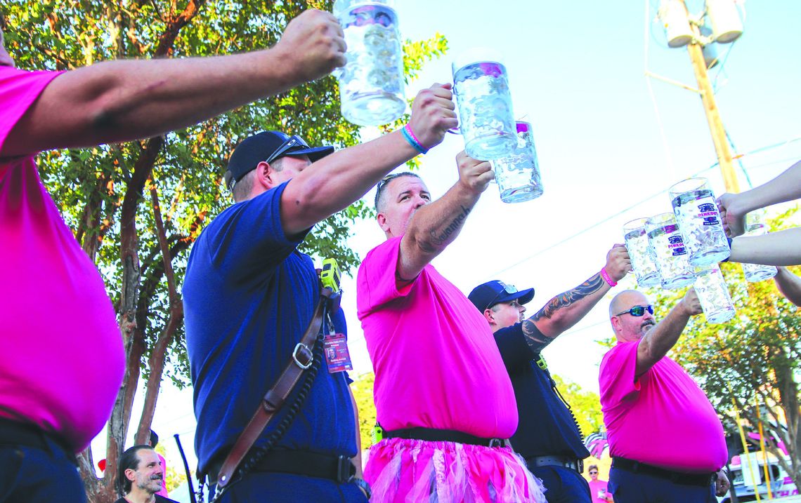 First responders competed in the Stein Hold at Pinktoberfest in Harmony Park Oct. 24. Find more photos on Page 14. Martelle Luedecke/Luedecke Photography