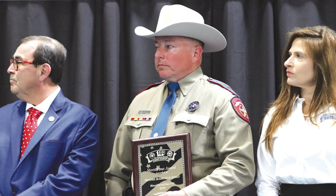 On March 6, from left, Sen. Pete Flores, Meritorious Service Award recipient Trooper Franklin Randolph and Chairwoman Stephanie Fisher listened to the recounting of Randolph's bravery during the Hill Country 100 Club Awards Banquet in Burnet. Martelle Luedecke/Luedecke Photography