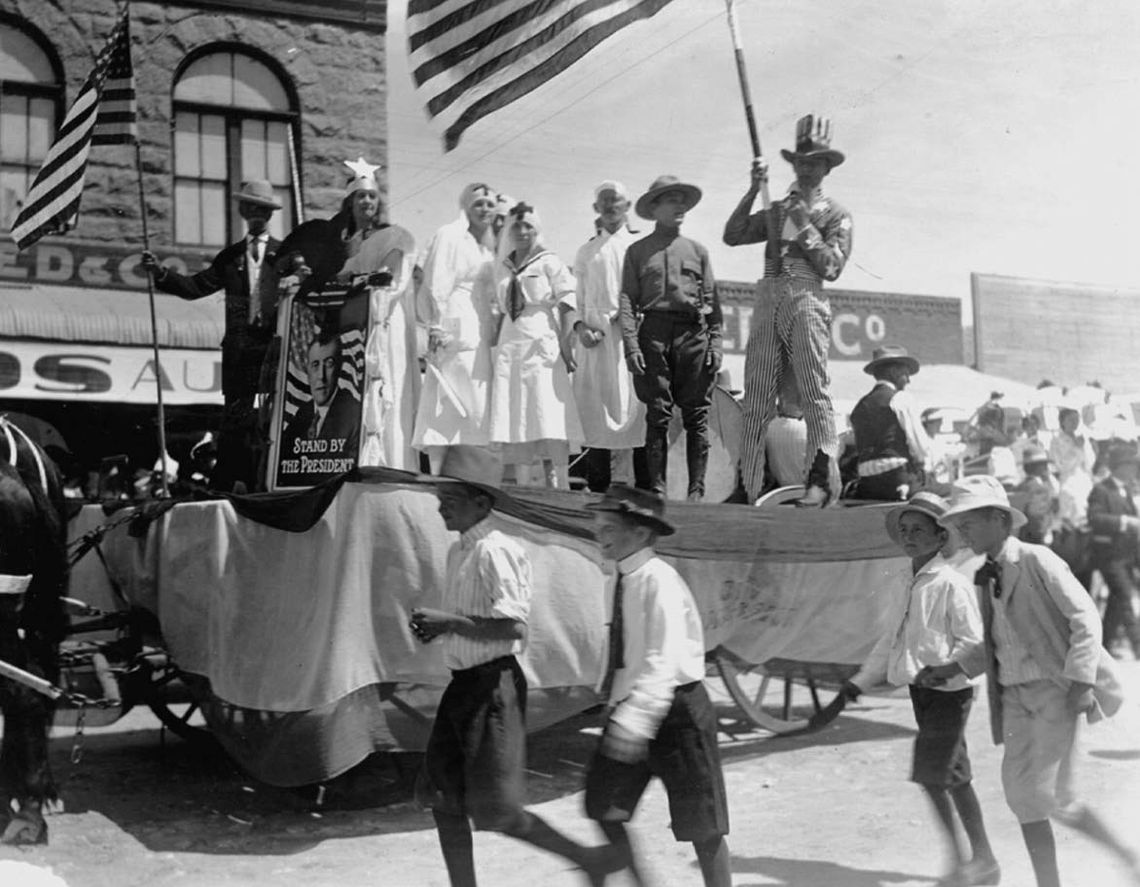 A patriotic parade float, captured in an area which is now Third Street and Main in Marble Falls, reveals its time period as riders hold an image of President Woodrow Wilson. Wilson was president of the United States from 1913 to 1921. Archives/Pictorial History of Marble Falls