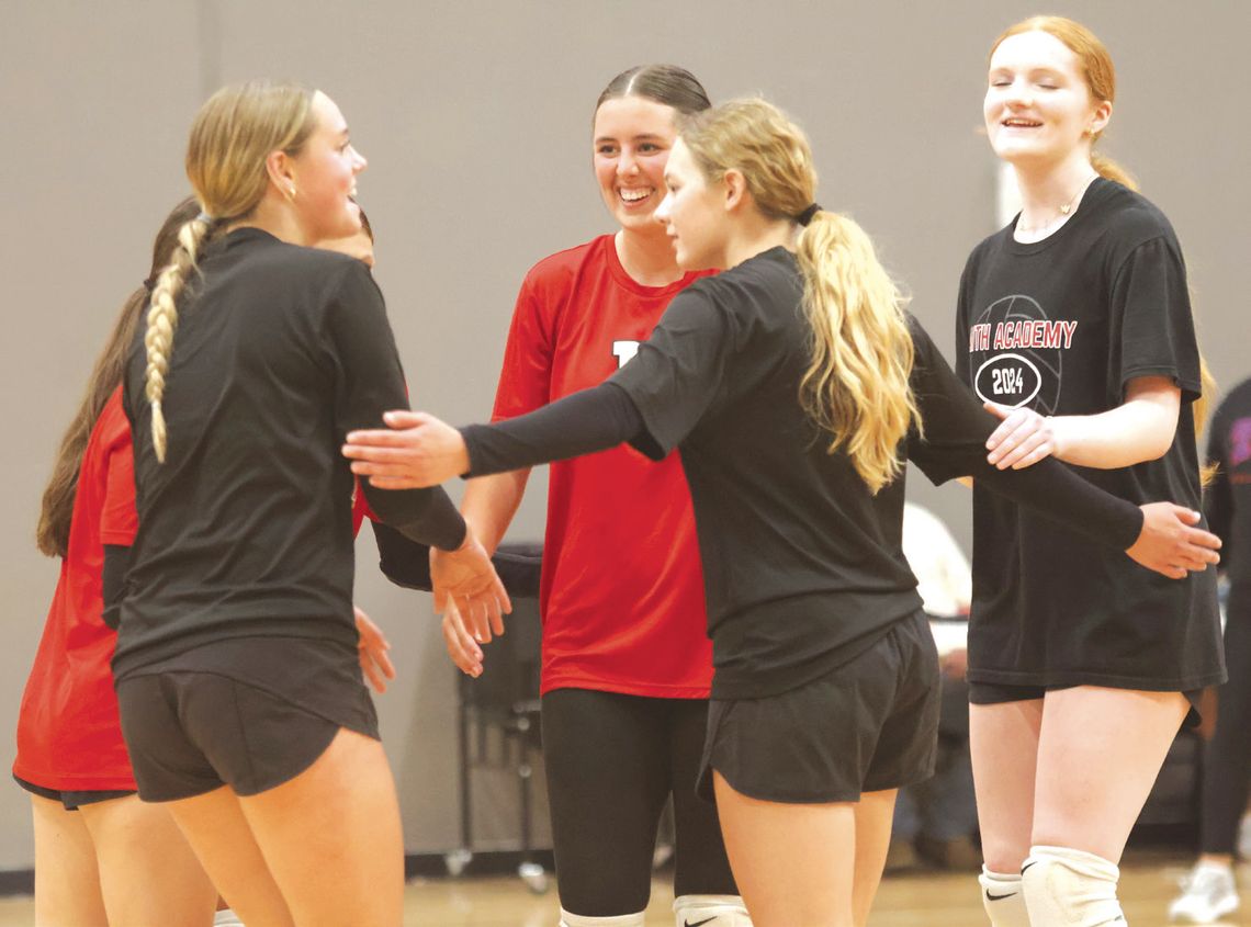 Liv Kraenzel (left) was congratulated on a great play by teammates Reese Ramsey, Elizabeth Neely, Kerrington Silvers and Ava Beltran.