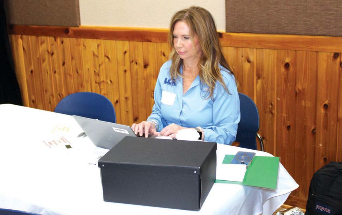 Lower Colorado River Authority Water Quality Supervisor Kelly Vinson prepares to receive local comments related to the proposed rock quarry near Hoover Valley Road. Raymond V. Whelan/The Highlander