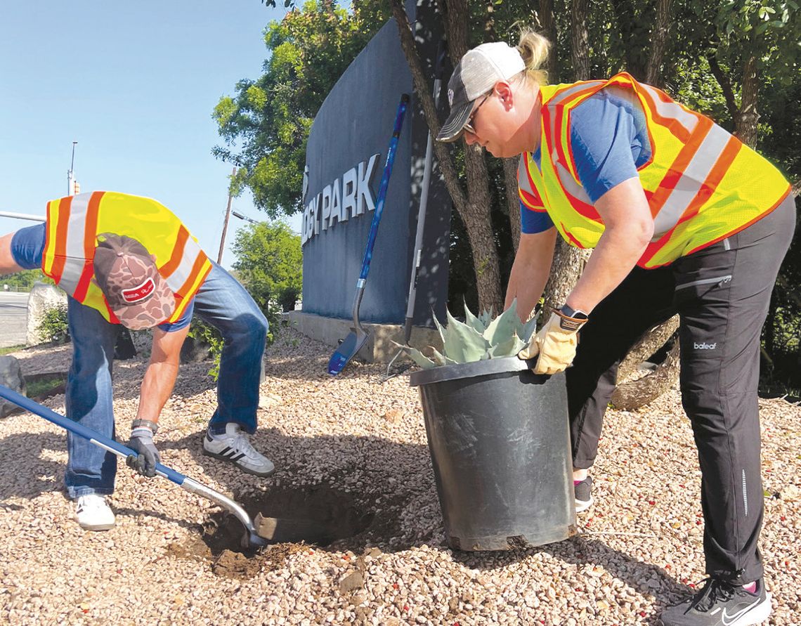 Contributed photo LCRA employees, Matt Phillips and Monica Masters, planted droughttolerant plants at the city business park in Marble Falls during LCRA's Steps Forward Day.