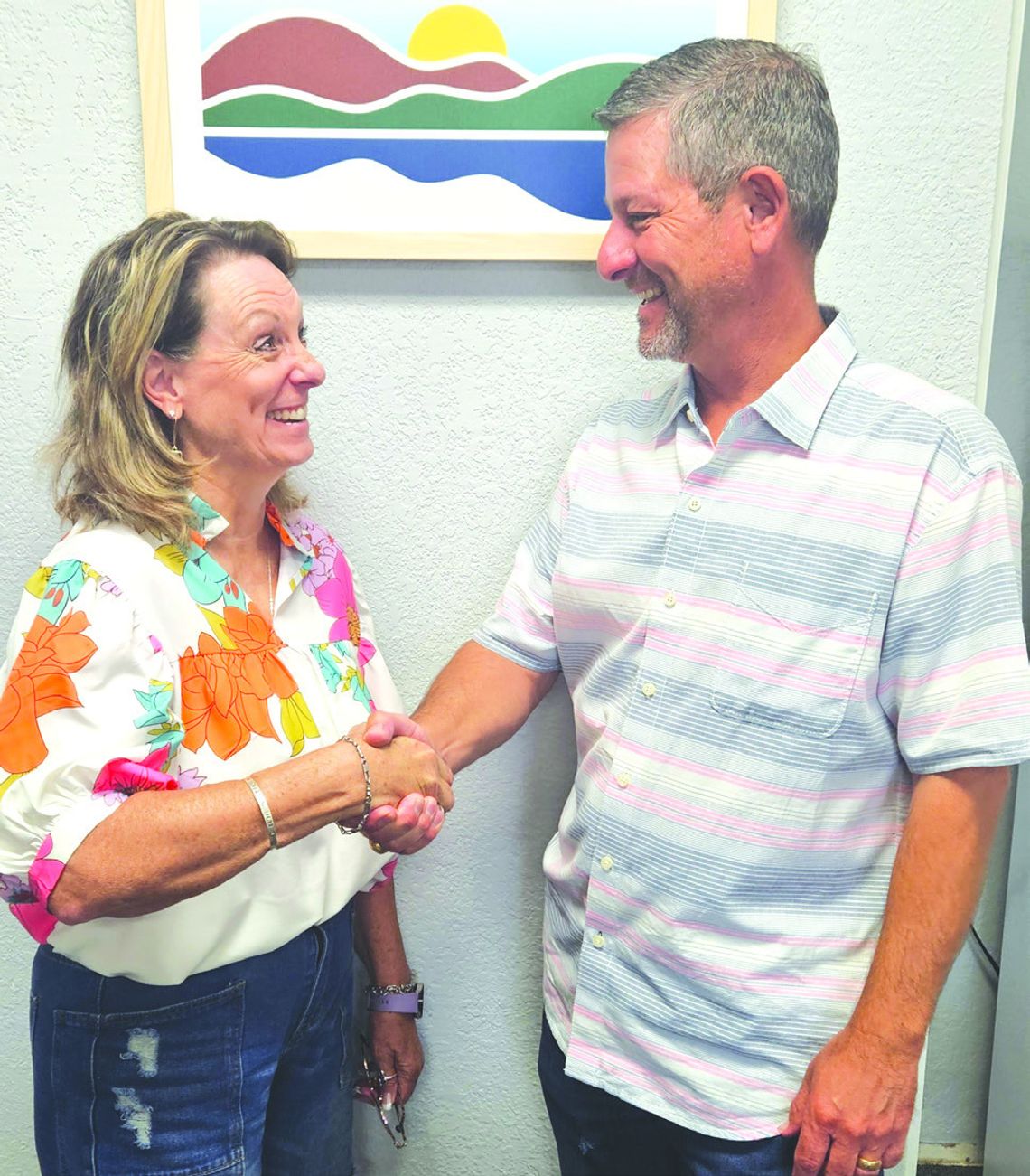 Kim Kankel, the new president/CEO of the Marble Falls/ Highland Lakes Area Chamber of Commerce, shook hands with Jarrod Metzgar, the outgoing president/ CEO of the area chamber. Contributed photo