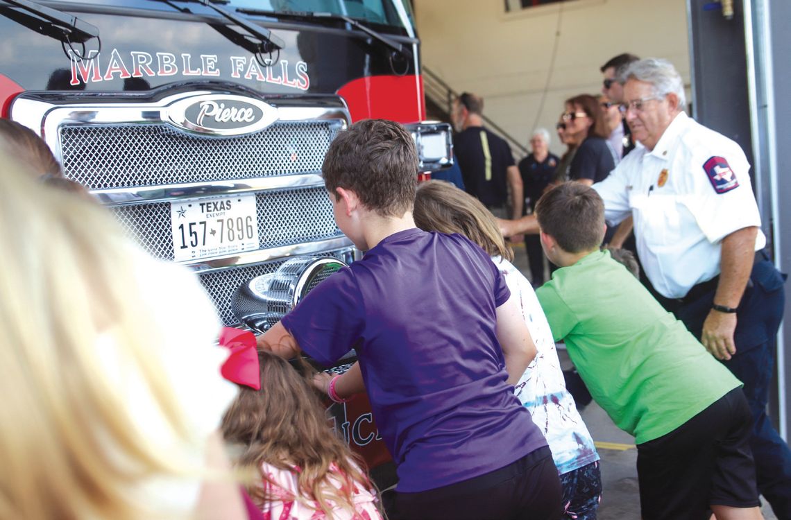 Residents of all ages assisted in the fire truck push-in ceremony June 4 at the Marble Falls Fire Rescue station. Photos by Martelle Luedecke/Luedecke Photography