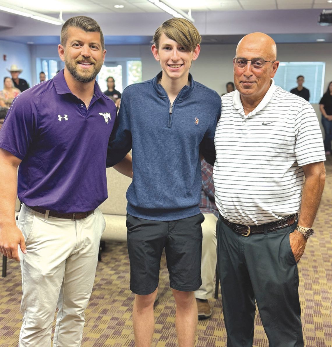 From left, Coach Austin Silva, runner Tyler Hamblin, and Coach Chris Schrader savor the moment  Hamblin was the only track and field state finalist this year. Contributed photos