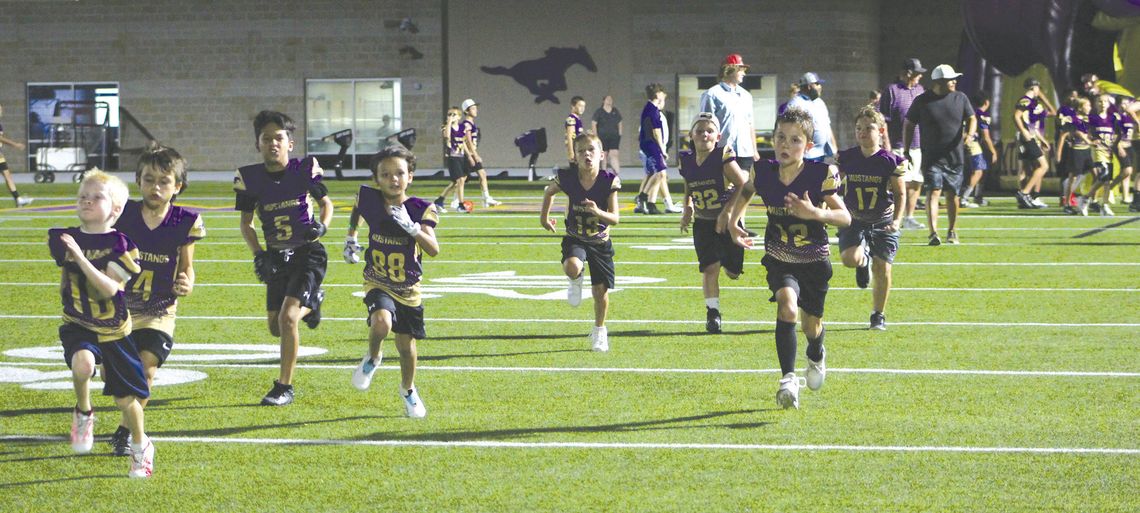 Players of the Marble Falls Youth Football and Cheer will run through the giant Mustang tunnel Saturday, Sept. 7, to begin the 2024 season. Photos by Jennifer Fierro/TexasChalkTalk.com