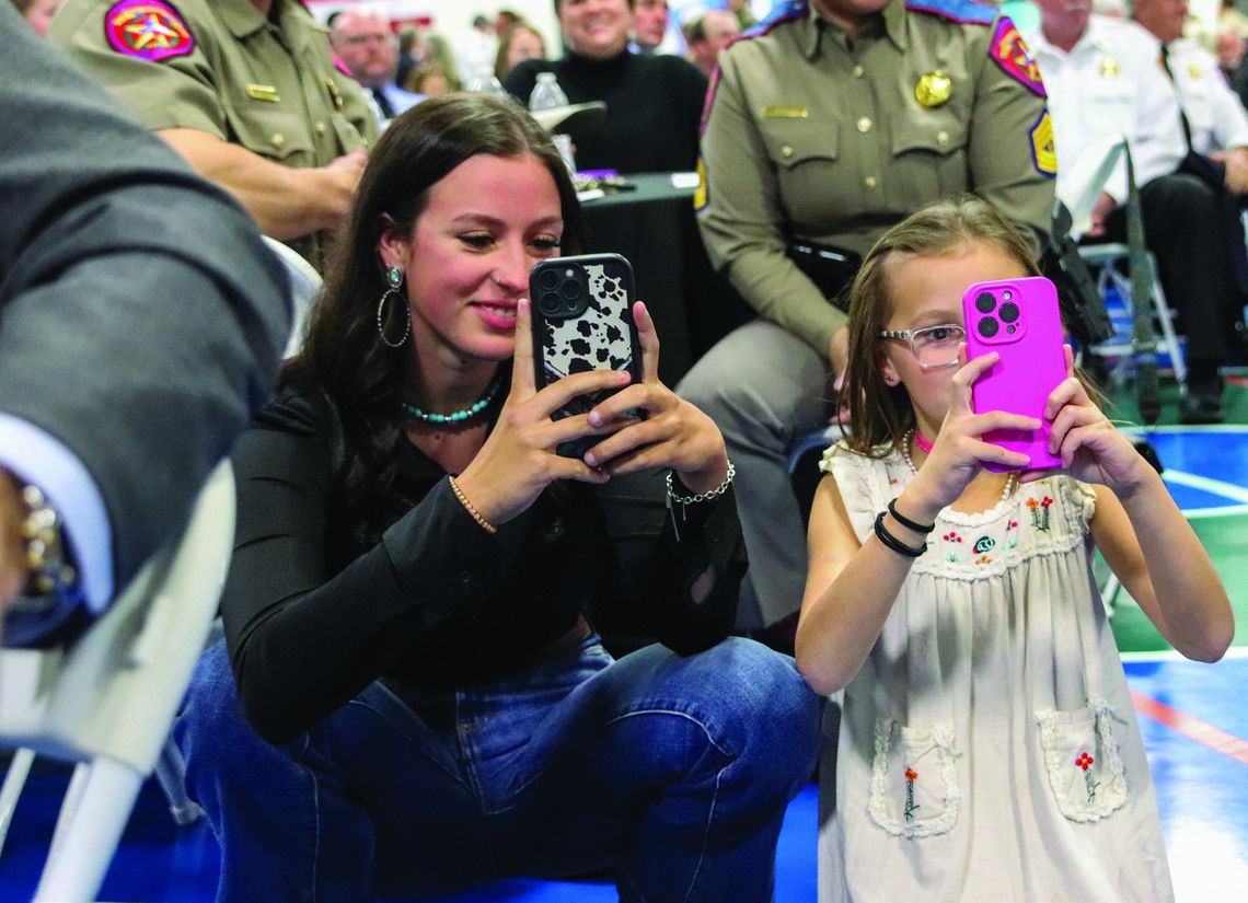 'Yay Daddy' was the cheer from Morgan and Emily Randolph, when Troop - er Franklin Randolph's name was called to accept his award March 6 during the Hill Country 100 Club Awards Banquet at the YMCA of the Highland Lakes.