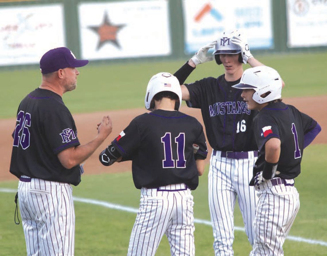 Head coach Tyler Porter (left) talks to Grant Carter (11), Braxton Dicken (1) and Owen Nash.