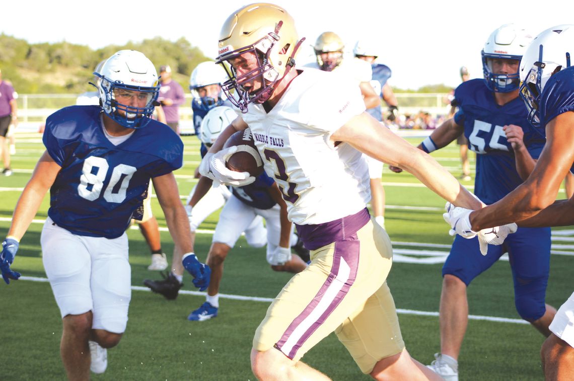 Marble Falls senior receiver Parker Phillips runs for a first down during the scrimmage against Lago Vista Aug. 15.