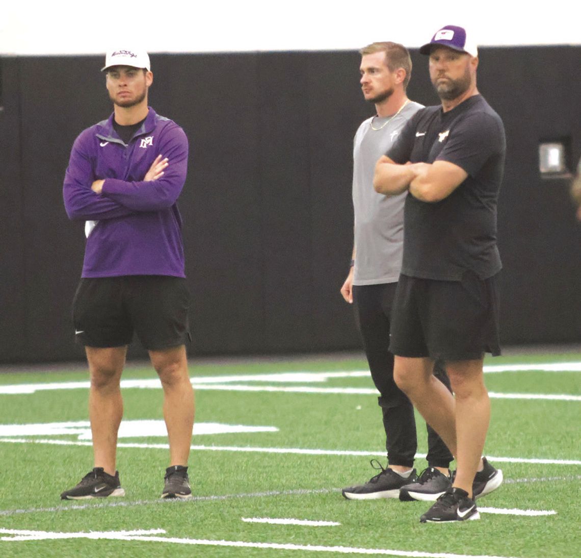 Marble Falls head coach Keri Timmerman (right) is pictured with coaches Hayden Kesselring (left) and Logan Simmons, the program's new offensive coordinator.