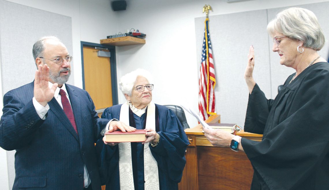Pct. 4 justice of the peace sworn in On Feb. 7, Frank Reilly, who was appointed by Burnet County commissioners to fill the precinct 4 justice of the peace spot, places his hand on the Bible held by the Rev. Sally Anderson. He was sworn in by (right) retiring Pct. 4 Justice of the Peace Debbie Bindseil. The ceremony was held i...