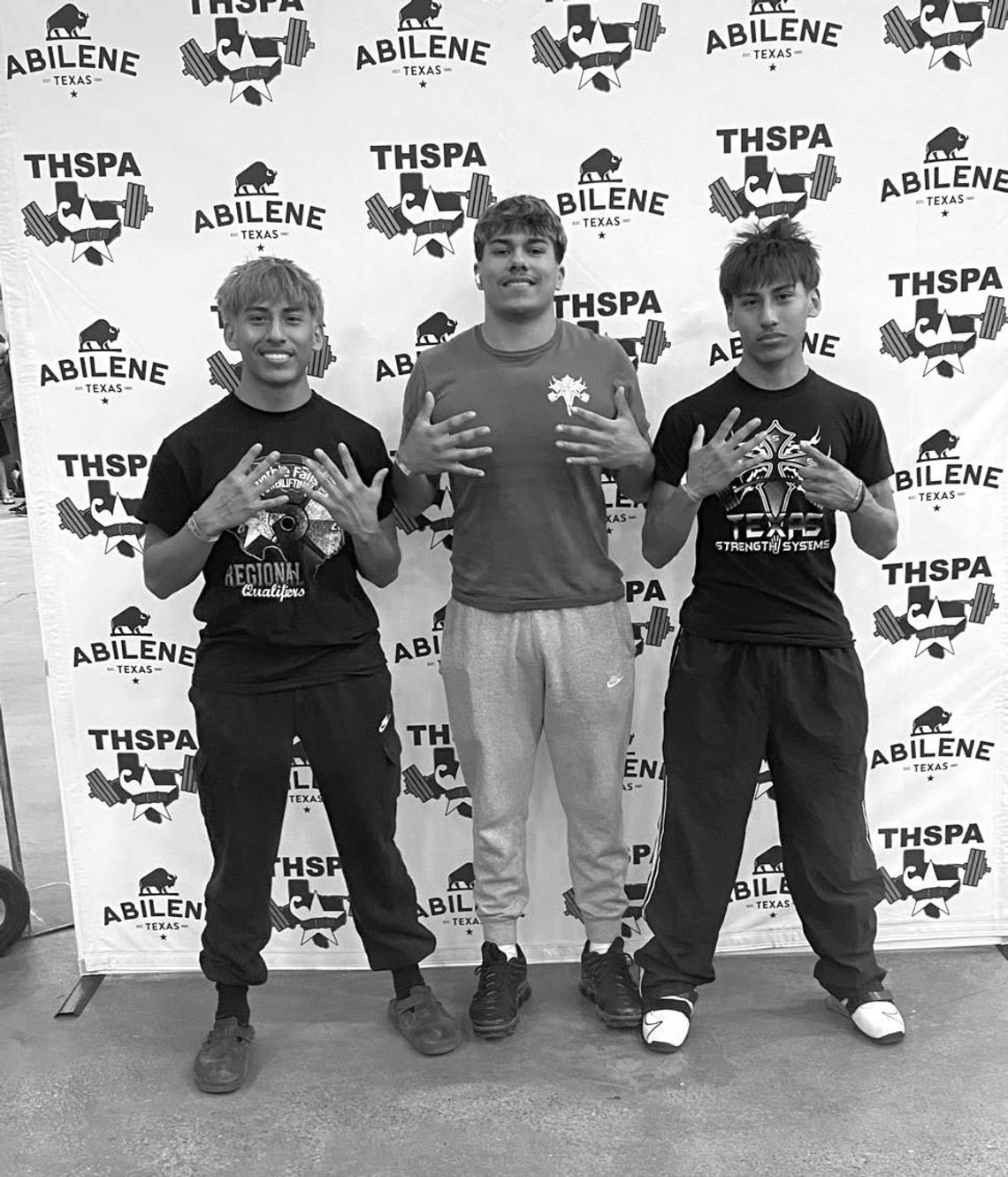 Powerliftters David Dominguez (left), Arnulfo Salazar and Daniel Dominguez are ready for the start of the Division