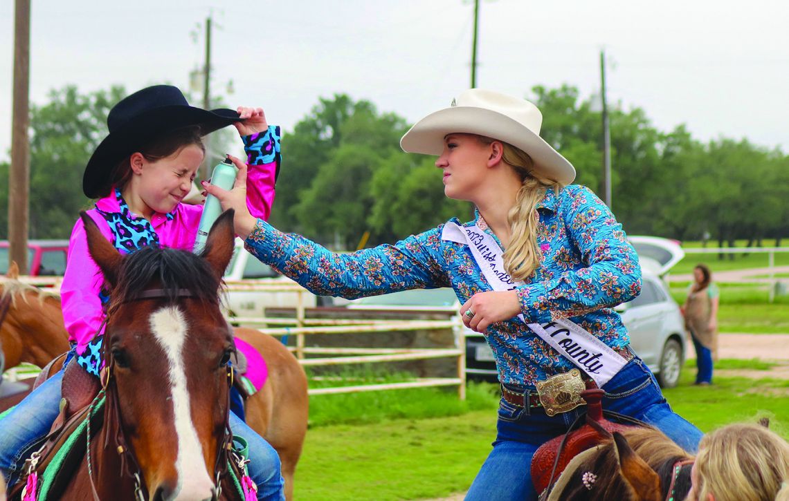 Rodeo scholarship pageant brings out the best Jade Simon raised her hat for Trinity Frazier to apply more hairspray to keep her hat from flying off Saturday, May 4, at the Burnet County Rodeo Association 2024 Scholarship Pageant. See more photos on Page 14. Martelle Luedecke/Luedecke Photography