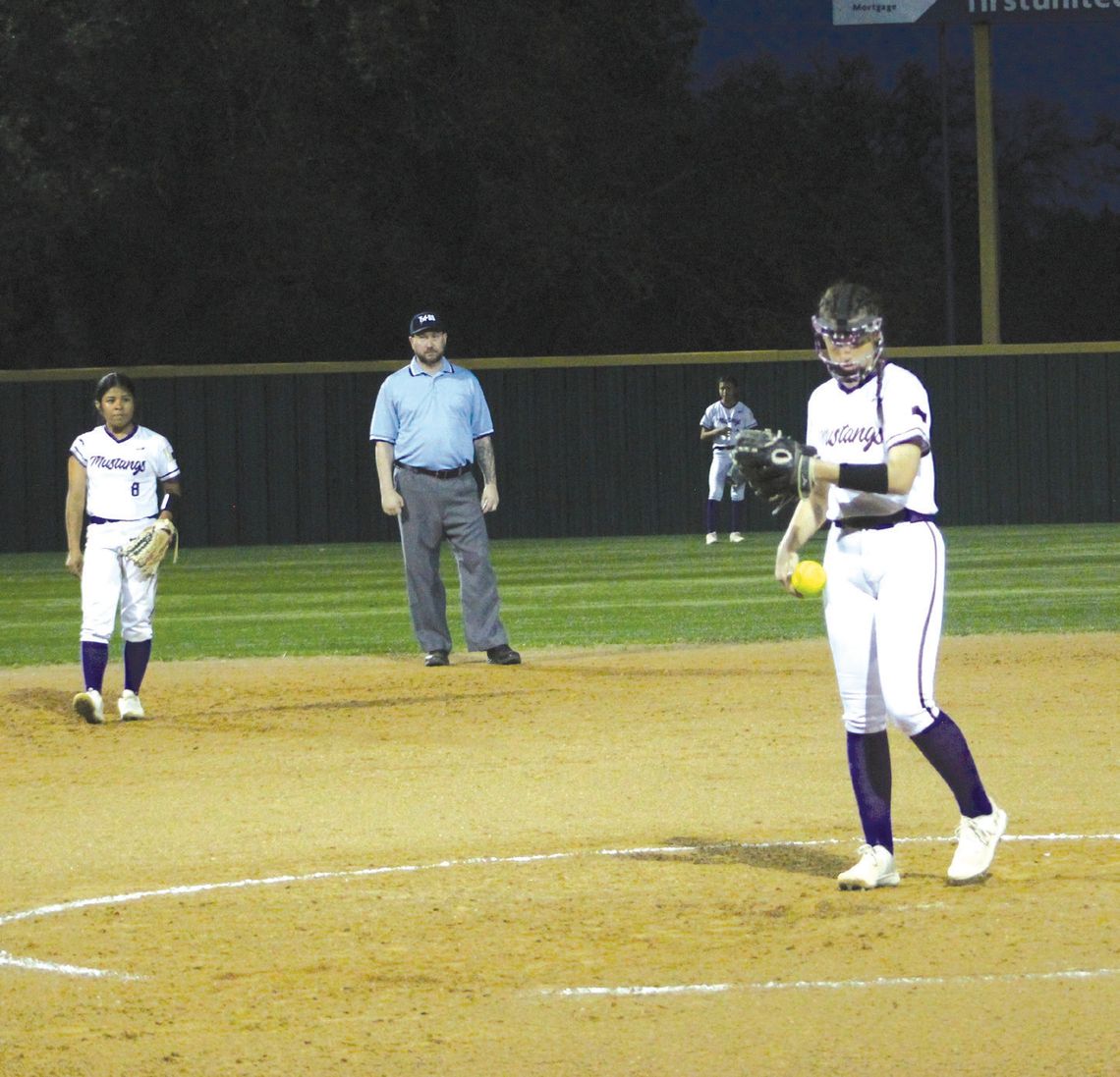 Marble Falls pitcher Camille Catalfamo checks her wristband after reading the sign from the catcher to know what pitch to throw. Photos by Jennifer Fierro/TexasChalkTalk.com