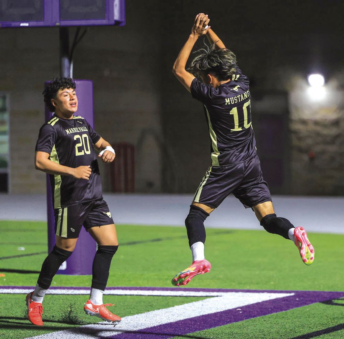 Joaquin Aguilar (lett) jumps with Marco Almazan as the Mustangs begin to celebrate a late goal against Davenport.