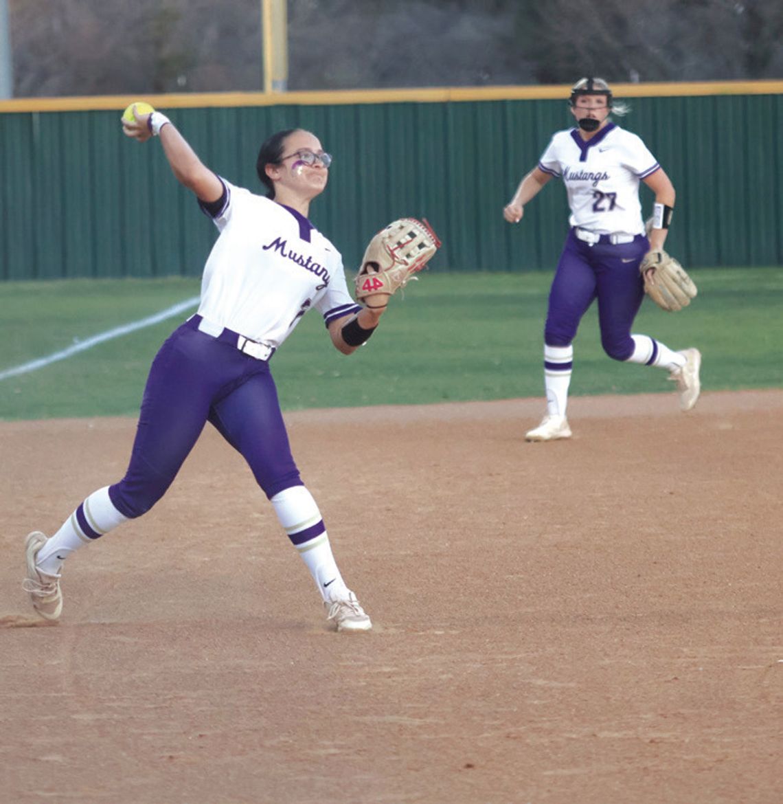 Third baseman Cheyenne Thompson (left) and shortstop Kylie Roberts made every play when the ball bounced their way to frustrate Lampasas and help their team win.