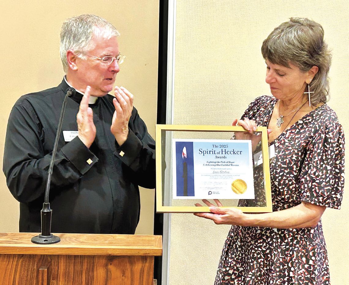 St. Paul's Pastor Fr. Brad Schoeberle, C.S.P., presented the 2025 Hecker Award for service to her parish and community to longtime St. Paul's parishioner and