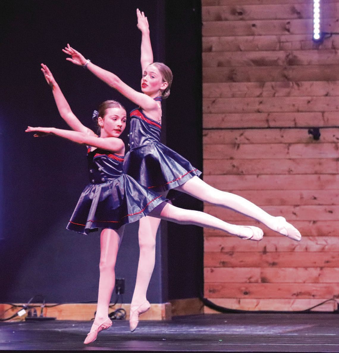 Harmony School of Creative Arts Academy of Dance spring performance, Dance 365, dress rehearsal was held May 15 at Hill Country Fellowship. Pic tured are Natalie Howlett and Hannah Burks, during a patriotic feature in the show. Find more photos on Pages 7 and 8. Martelle Luedecke/Luedecke...