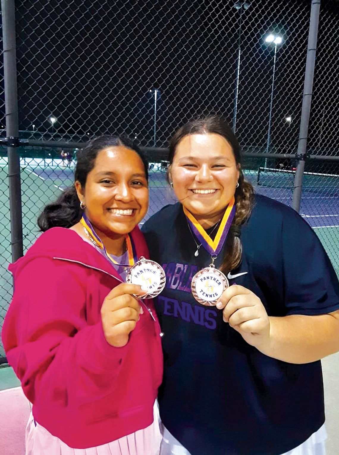 Mia Hernandez (left) and Sophia Trudeau placed third in the A Division of girls doubles at the Liberty Hill tournament April 11.