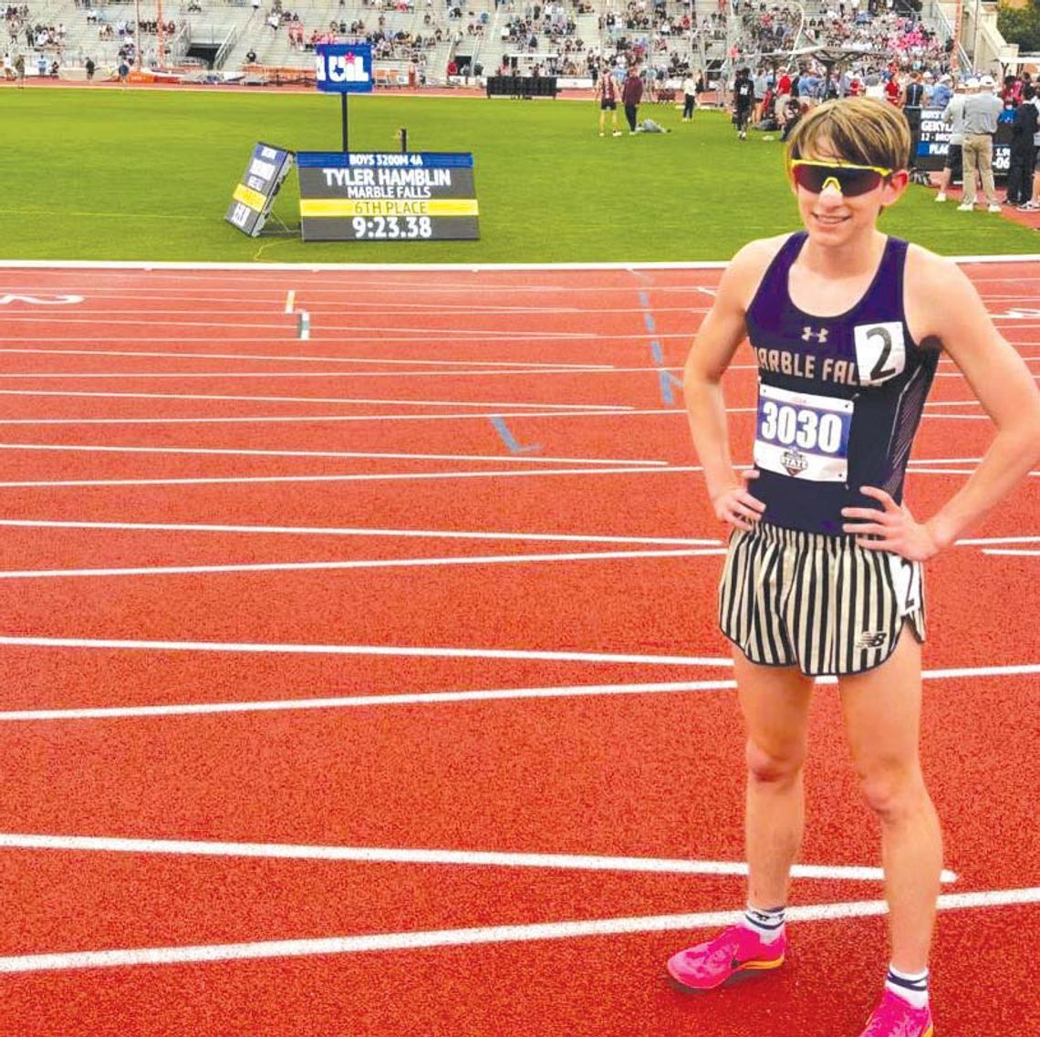 Marble Falls junior Tyler Hamblin stands in front of the scoreboard that flashes his time and finish in the 3,200 meters at the Class 4A State Track and Field Championships May 2. Contributed photo
