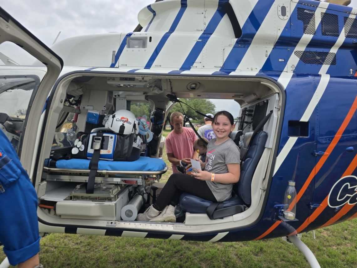 Kingsland School student Aria enjoyed an imaginary ride in the skies from the seat of a helicopter April 26 at the Toucha- Truck fundraiser for the Boys &amp; Girls Club in Kingsland.