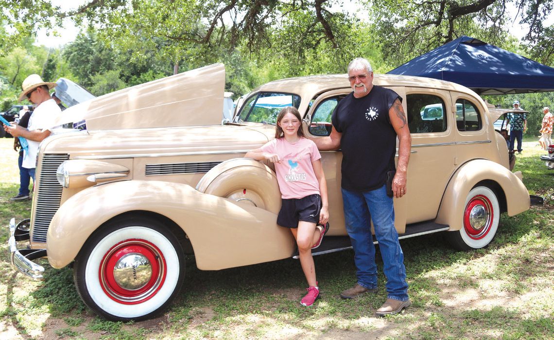 Natalie Pearson posed with her grandfather in front of their 1937 Buick Roadmaster entry. Photos by Martelle Luedecke/Luedecke Photography