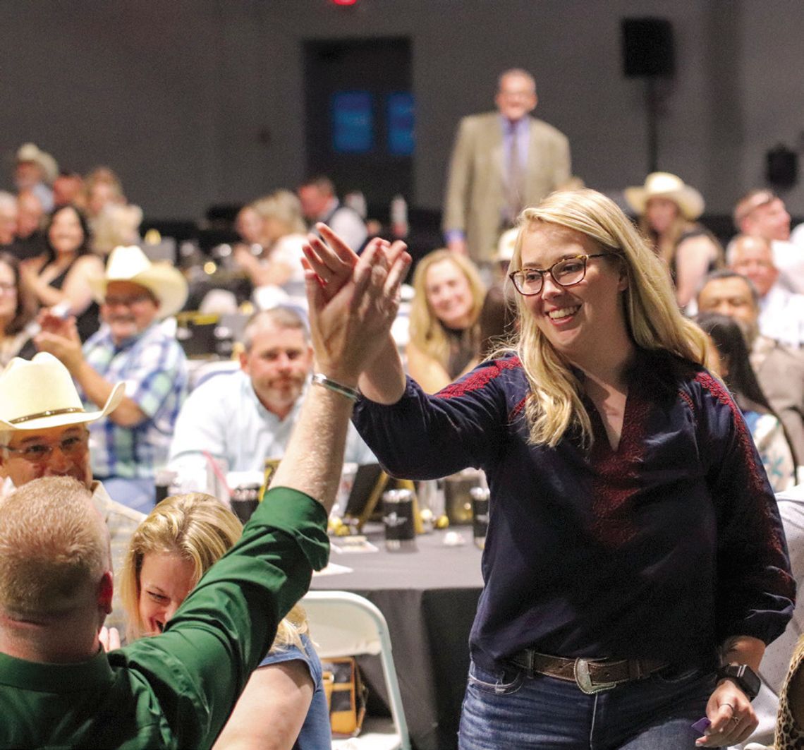 Wags to Riches raises $170K to help save animals Raffle winner Shelby Huffman high-fived for the cause April 26 during the Wags to Riches Hill Country Humane Society fundraiser at the YMCA of the Highland Lakes. Photos by Martelle Luedecke/Luedecke Photography
