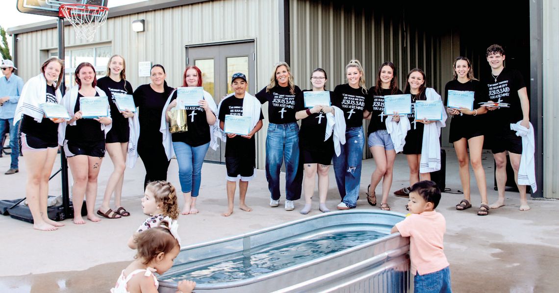Photos by Martelle Luedecke/ Luedecke Photography After their baptism through Young-Lives at Hill Country Fellowship, participants draped in towels posed with their bibles and certificates March 24.